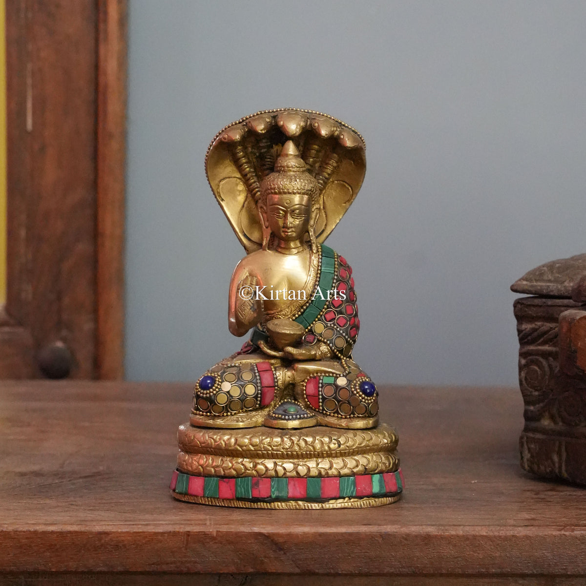 Brass Buddha Sheltered by the Serpent King's Hood