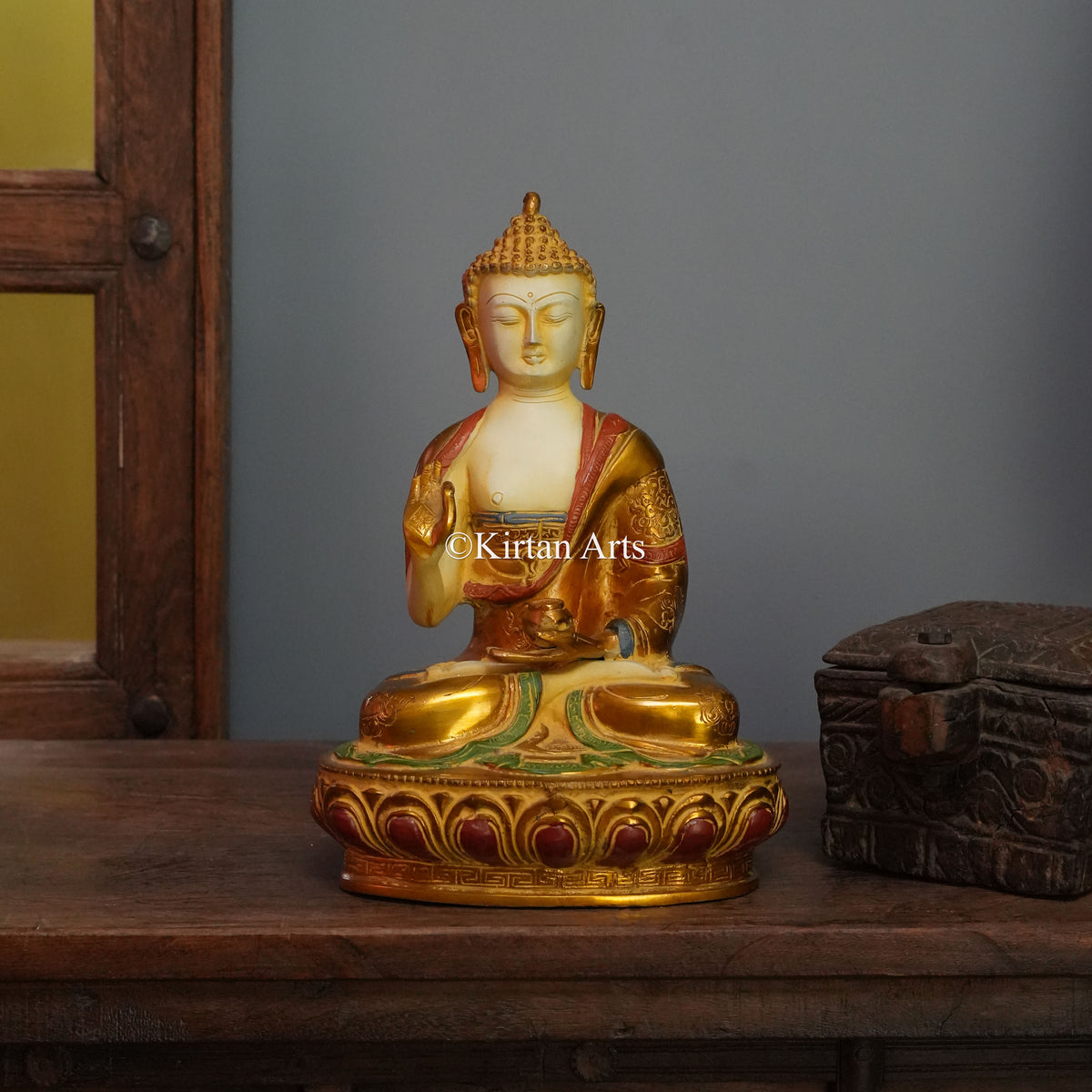 Ivory-Faced Brass Buddha with Gilded Robe and Red Trim