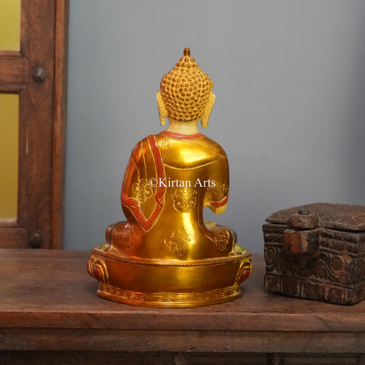 Ivory-Faced Brass Buddha with Gilded Robe and Red Trim